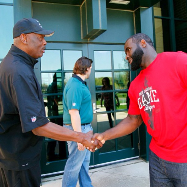 Making friends with legends. Harold Carmichael welcomes pick Bennie Logan to Philadelphia.